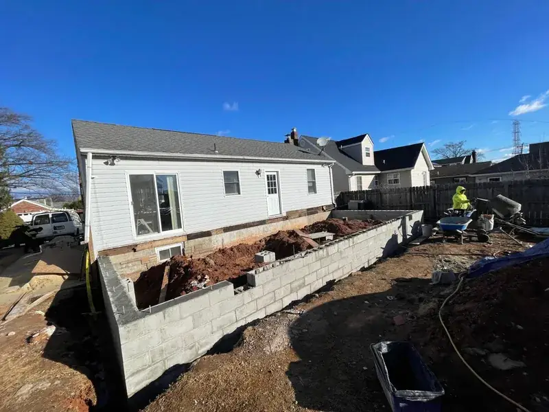 Alpha Project crew building a block foundation for a home addition in New Jersey