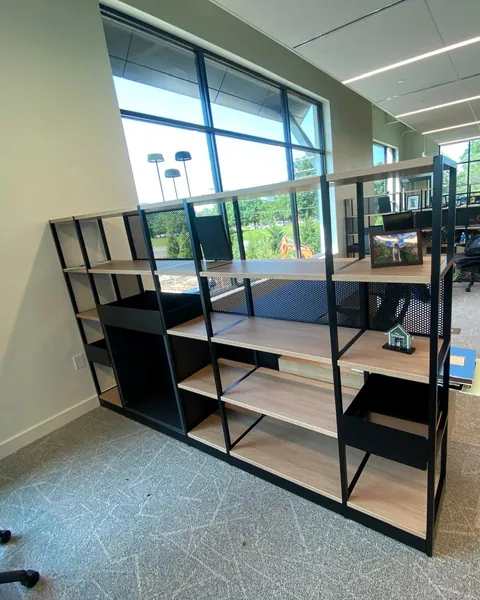 Metal and wood shelving divider in an open office